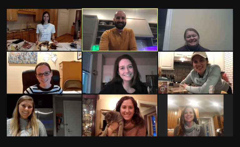 DIS employees smiling during a virtual cheeseboard class.